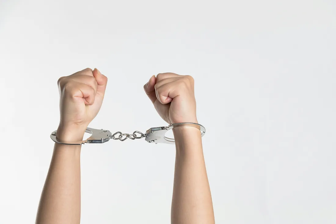 Hands in handcuffs - criminal defence lawyer Hands in handcuffs - criminal defence lawyer